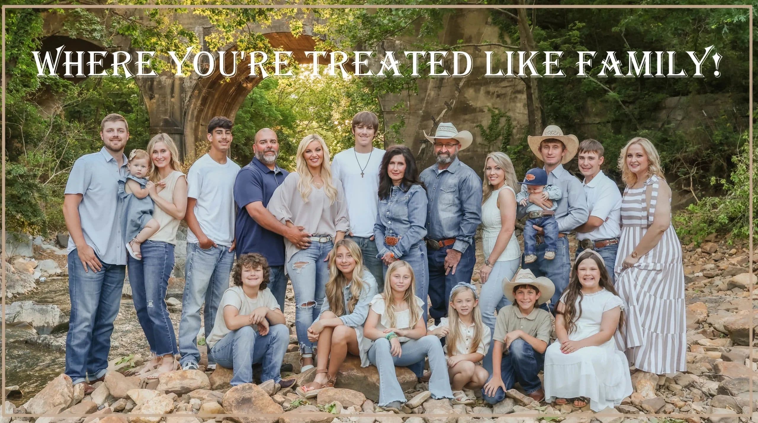 Large family posing outdoors with text: "Where you're treated like family!"